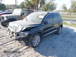 2012 Volkswagen Tiguan SE with VIN WVGAV7AX8CW565863, listed as a IAAI auction lot 41528643 with 122,569 mi miles and . Bid and sale history available at DreamBid. Image 2.