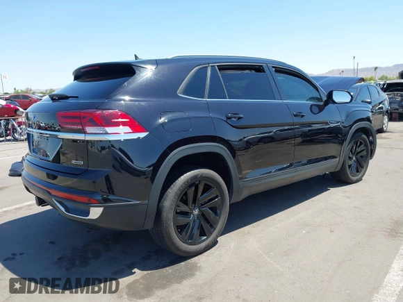 2022 Volkswagen Atlas SE z VIN 1V2KE2CA8NC220310, wystawiony jako IAAI lot #42218718 z przebiegiem 28 603 mil mil oraz . Historia ofert i sprzedaży dostępna na DreamBid. Obrazek 4.