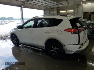 2016 Toyota RAV4 SE with VIN JTMJFREV0GD190302, listed as a Copart auction lot 59330345 with 102,069 mi miles and Salvage title. Bid and sale history available at DreamBid. Image 2.