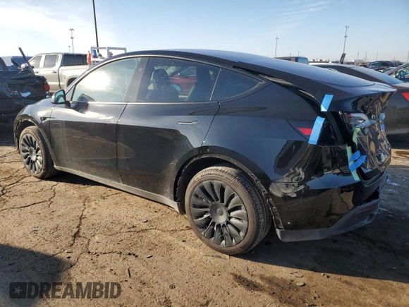 2024 Tesla Model Y Long Range with VIN 7SAYGDEE5RA270382, listed as a Copart auction lot 82899494 with 6,401 mi miles and Clean title. Bid and sale history available at DreamBid. Image 2.