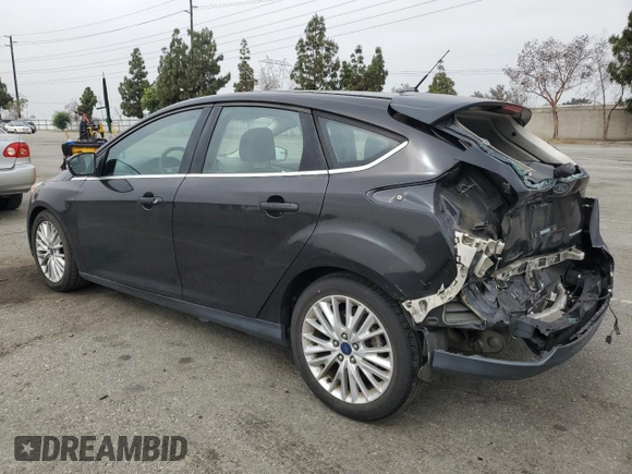 2015 Ford Focus Titanium z VIN 1FADP3N25FL324390, wystawiony jako Copart lot #59801805 z przebiegiem 97 615 mil mil oraz Szkoda całkowita • Salvage title. Historia ofert i sprzedaży dostępna na DreamBid. Obrazek 2.