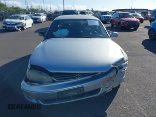 1995 Toyota Camry LE z VIN 4T1GK12W1SU100177, wystawiony jako IAAI lot #41338427 z przebiegiem 128 733 mil mil oraz . Historia ofert i sprzedaży dostępna na DreamBid. Obrazek 11.