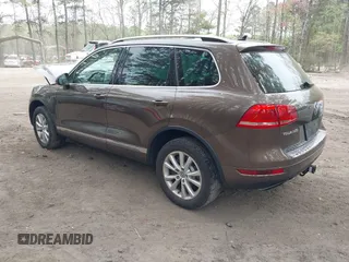 2014 Volkswagen Touareg Sport with VIN WVGEF9BP2ED007904, listed as a IAAI auction lot 41960811 with 126,230 mi miles and . Bid and sale history available at DreamBid. Image 3.