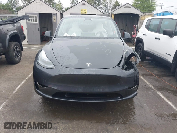 2025 Tesla Model Y Long Range with VIN 7SAYGDED8SA340082, listed as a IAAI auction lot 41915369 with 7,296 mi miles and . Bid and sale history available at DreamBid. Image 13.