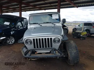 2006 Jeep Wrangler Sport with VIN 1J4FA49S46P748604, listed as a IAAI auction lot 41788157 with 128,249 mi miles. Bid and sale history available at carsss.com. Image 12.