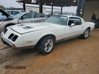1979 Pontiac Firebird z VIN 2U87K9N120105, wystawiony jako Copart lot #84729164 z przebiegiem 87 739 mil mil oraz Tytuł czysty. Historia ofert i sprzedaży dostępna na DreamBid. Obrazek 1.