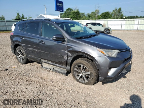 2016 Toyota RAV4 XLE with VIN JTMRFREV0GJ082234, listed as a Copart auction lot 64941855 with 193,270 mi miles and Salvage title. Bid and sale history available at DreamBid. Image 4.