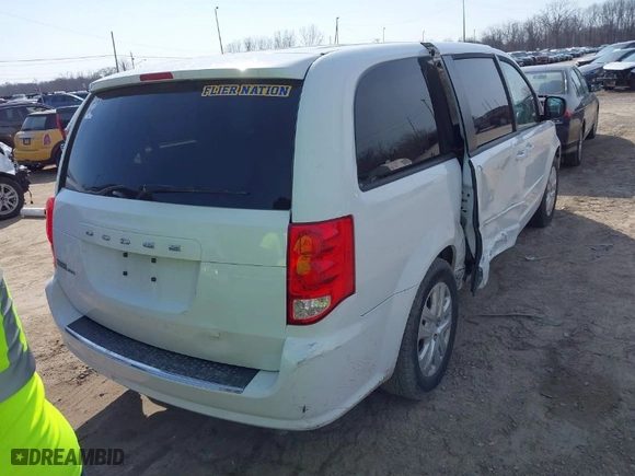 2016 Dodge Grand Caravan American Value Pkg with VIN 2C4RDGBG8GR284928, listed as a IAAI auction lot 41742483 with 96,909 mi miles. Bid and sale history available at carsss.com. Image 16.