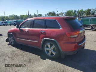 2011 Jeep Grand Cherokee Overland with VIN 1J4RR6GT8BC606688, listed as a Copart auction lot 57182295 with 100,423 mi miles and Salvage title. Bid and sale history available at DreamBid. Image 2.