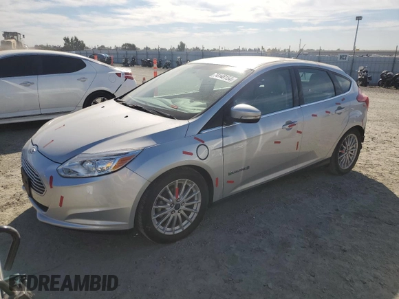 2014 Ford Focus Electric with VIN 1FADP3R45EL287285, listed as a Copart auction lot 74148154 with 64,543 mi miles and Salvage title. Bid and sale history available at DreamBid. Image 1.