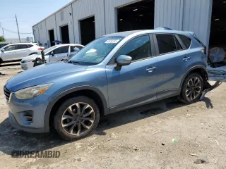 2016 Mazda CX-5 Grand Touring with VIN JM3KE2DYXG0680576, listed as a Copart auction lot 52430195 with 138,168 mi miles and Salvage Title. Bid and sale history available at carsss.com. Image 1.