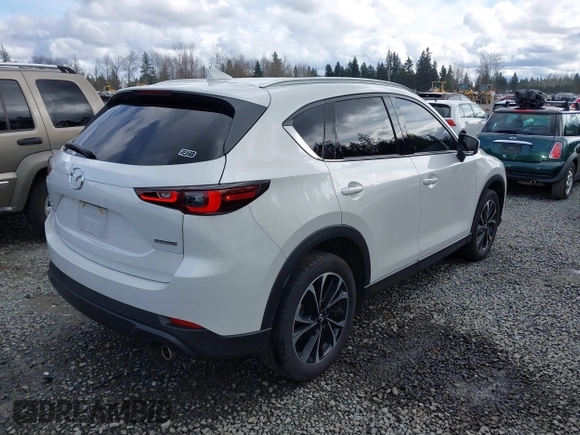 2023 Mazda CX-5 2.5 S Premium Plus Package with VIN JM3KFBEM3P0236481, listed as a IAAI auction lot 41815369 with 34,679 mi miles. Bid and sale history available at carsss.com. Image 4.