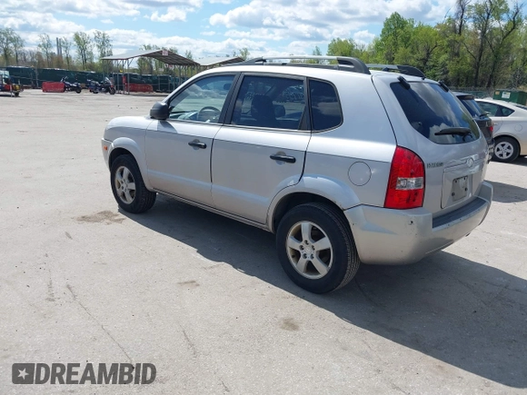 2005 Hyundai Tucson GL with VIN KM8JM12B75U075660, listed as a IAAI auction lot 42037735 with 157,453 mi miles. Bid and sale history available at carsss.com. Image 3.