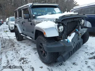 2015 Jeep Wrangler Unlimited Rubicon Hard Rock with VIN 1C4HJWFG1FL659803, listed as a IAAI auction lot 41172485 with 126,881 mi miles. Bid and sale history available at carsss.com. Image 1.