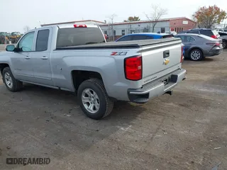 2018 Chevrolet Silverado 1500 LT with VIN 1GCVKREH9JZ362330, listed as a IAAI auction lot 40738418 with 77,814 mi miles. Bid and sale history available at carsss.com. Image 3.