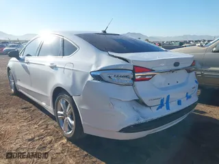2018 Ford Fusion Hybrid S with VIN 3FA6P0UU0JR204324, listed as a IAAI auction lot 41312303 with 100,527 mi miles. Bid and sale history available at carsss.com. Image 6.
