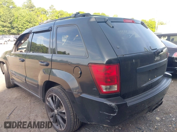 2005 Jeep Grand Cherokee Laredo z VIN 1J4GR48K65C725099, wystawiony jako IAAI lot #42509223 z przebiegiem 249 216 mil mil oraz . Historia ofert i sprzedaży dostępna na DreamBid. Obrazek 3.