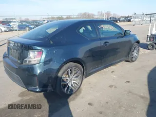 2015 Scion tC with VIN JTKJF5C71F3090963, listed as a IAAI auction lot 41802183 with 107,650 mi miles. Bid and sale history available at carsss.com. Image 4.