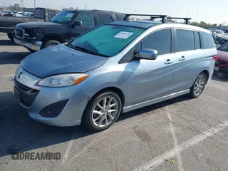 2012 Mazda 5 Grand Touring with VIN JM1CW2DL6C0126640, listed as a IAAI auction lot 42076722 with 124,412 mi miles and . Bid and sale history available at DreamBid. Image 2.