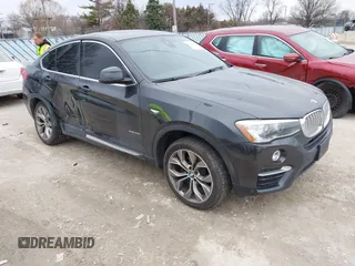 2018 BMW X4 xDrive28i z VIN 5UXXW3C50J0T82049, wystawiony jako IAAI lot #41911869 z przebiegiem 99 771 mil mil oraz . Historia ofert i sprzedaży dostępna na DreamBid. Obrazek 1.
