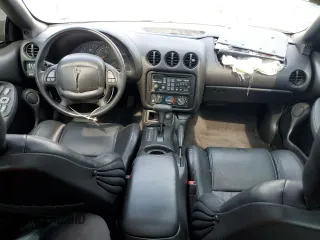 2001 Pontiac Firebird Formula z VIN 2G2FV22G912123611, wystawiony jako Copart lot #56820064 z przebiegiem 55 319 mil mil oraz Szkody całkowita. Historia ofert i sprzedaży dostępna na DreamBid. Obrazek 8.