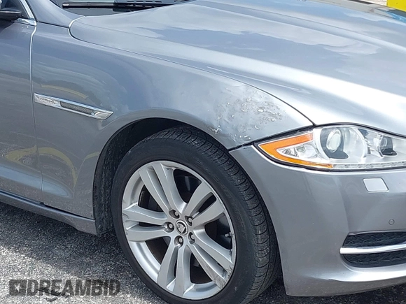 2013 Jaguar XJ with VIN SAJWJ1CD4D8V46305, listed as a IAAI auction lot 42637329 with 101,532 mi miles and . Bid and sale history available at DreamBid. Image 6.