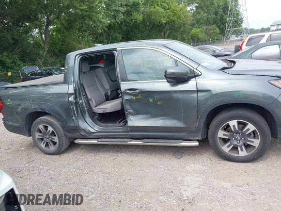 2018 Honda Ridgeline RTL-T with VIN 5FPYK3F61JB013733, listed as a IAAI auction lot 42548122 with 92,407 mi miles and . Bid and sale history available at DreamBid. Image 13.