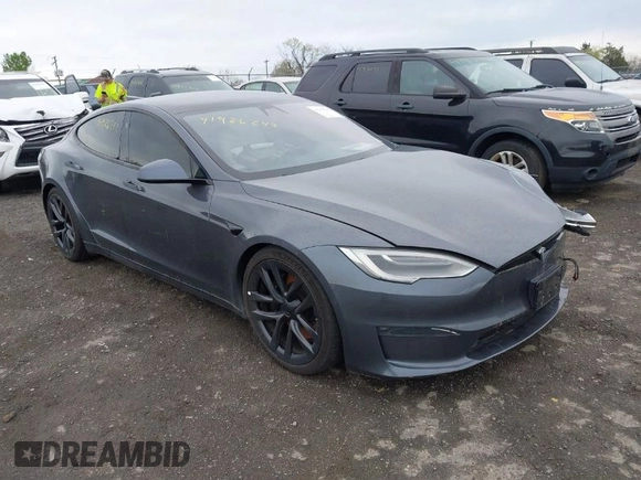 2021 Tesla Model S Long Range with VIN 5YJSA1E5XMF428519, listed as a IAAI auction lot 41926242 with 54,284 mi miles and . Bid and sale history available at DreamBid. Image 1.