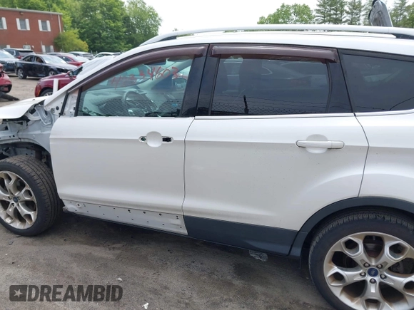 2016 Ford Escape Titanium with VIN 1FMCU9J92GUA71444, listed as a IAAI auction lot 42334603 with 79,780 mi miles and . Bid and sale history available at DreamBid. Image 14.