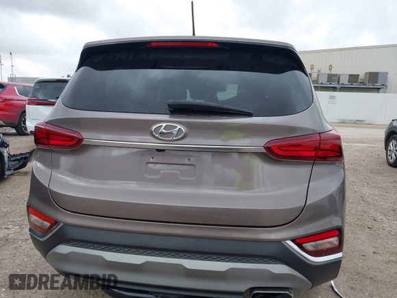 2019 Hyundai Santa Fe SE z VIN 5NMS23AD2KH014037, wystawiony jako IAAI lot #42110778 z przebiegiem 48 975 mil mil oraz . Historia ofert i sprzedaży dostępna na DreamBid. Obrazek 17.