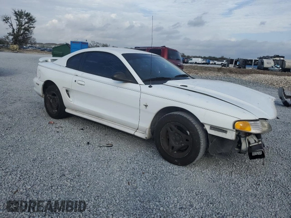 1997 Ford Mustang with VIN 1FALP4044VF174876, listed as a Copart auction lot 41601355 with 103,828 mi miles and Salvage Title. Bid and sale history available at carsss.com. Image 4.