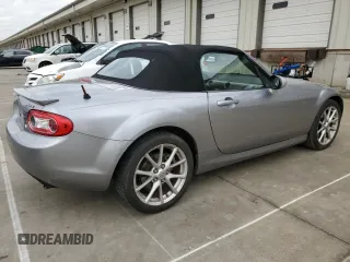 2009 Mazda MX-5 Miata Grand Touring z VIN JM1NC25F090202047, wystawiony jako Copart lot #55810505 z przebiegiem 91 618 mil mil oraz Szkody całkowita. Historia ofert i sprzedaży dostępna na DreamBid. Obrazek 3.