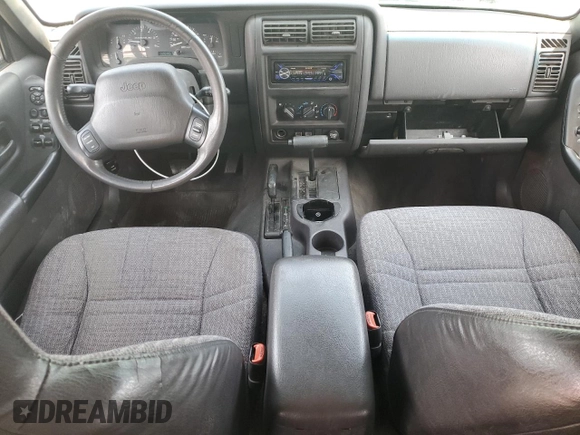 1999 Jeep Cherokee Sport with VIN 1J4FF68S2XL570795, listed as a Copart auction lot 61860585 with 320,467 mi miles and Salvage title. Bid and sale history available at DreamBid. Image 8.