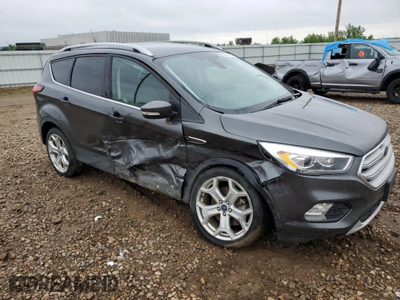 2019 Ford Escape Titanium z VIN 1FMCU9J99KUC31182, wystawiony jako Copart lot #60972815 z przebiegiem 94 464 mil mil oraz Szkoda całkowita • Salvage title. Historia ofert i sprzedaży dostępna na DreamBid. Obrazek 4.
