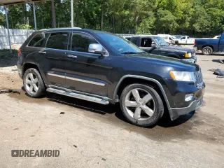 2012 Jeep Grand Cherokee Overland with VIN 1C4RJECTXCC227769, listed as a Copart auction lot 68760174 with 144,537 mi miles and Salvage Title. Bid and sale history available at carsss.com. Image 4.
