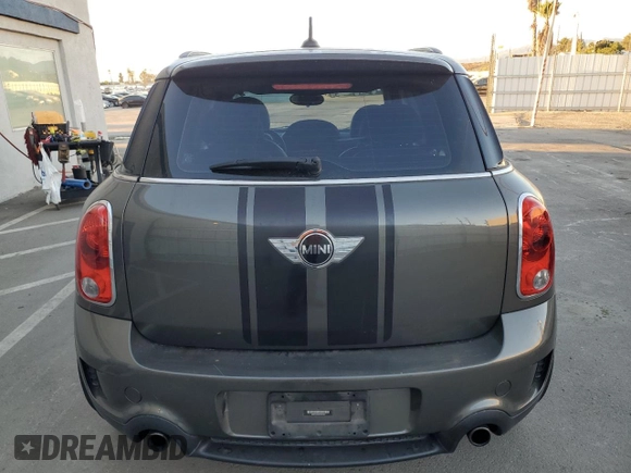 2014 MINI Countryman S with VIN WMWZC3C59EWP29137, listed as a Copart auction lot 79721804 with 124,871 mi miles and Salvage title. Bid and sale history available at DreamBid. Image 6.
