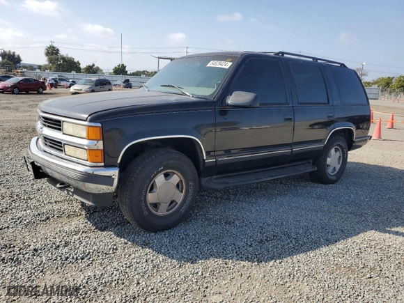 1999 Chevrolet Tahoe Z71 with VIN 1GNEK13R5XJ308924, listed as a Copart auction lot 64463984 with 229,181 mi miles and Salvage Title. Bid and sale history available at carsss.com. Image 1.
