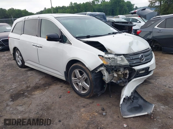 2012 Honda Odyssey Touring with VIN 5FNRL5H93CB034485, listed as a IAAI auction lot 42304502 with 198,589 mi miles and . Bid and sale history available at DreamBid. Image 1.
