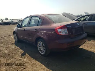 2011 Suzuki SX4 LE with VIN JS2YC5A2XB6302991, listed as a Copart auction lot 68815864 with 82,464 mi miles and Salvage Title. Bid and sale history available at carsss.com. Image 2.