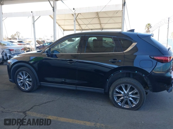 2020 Mazda CX-5 Grand Touring z VIN JM3KFADMXL0740144, wystawiony jako IAAI lot #41830203 z przebiegiem 70 535 mil mil oraz . Historia ofert i sprzedaży dostępna na DreamBid. Obrazek 14.