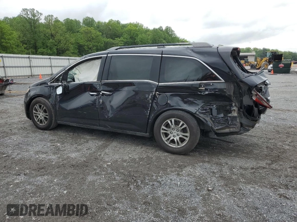 2013 Honda Odyssey EX-L with VIN 5FNRL5H69DB031498, listed as a Copart auction lot 55459745 with 129,773 mi miles and Salvage title. Bid and sale history available at DreamBid. Image 2.