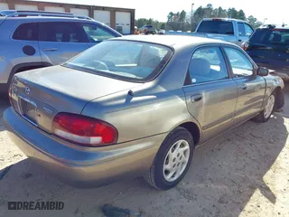 1999 Mazda 626 LX with VIN 1YVGF22D8X5871485, listed as a IAAI auction lot 41641049 with 115,603 mi miles. Bid and sale history available at carsss.com. Image 4.
