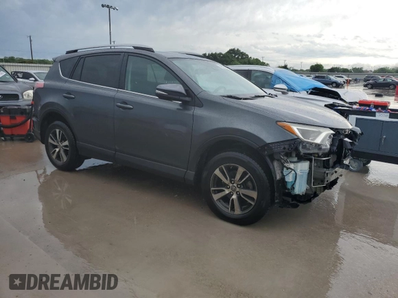 2018 Toyota RAV4 XLE with VIN 2T3WFREV6JW411935, listed as a Copart auction lot 54218405 with 123,831 mi miles and Salvage title. Bid and sale history available at DreamBid. Image 4.