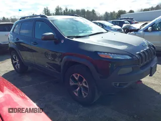 2014 Jeep Cherokee Trailhawk with VIN 1C4PJMBS3EW127749, listed as a IAAI auction lot 41836617 with 207,002 mi miles and . Bid and sale history available at DreamBid. Image 1.