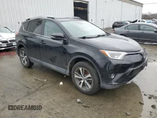 2018 Toyota RAV4 XLE with VIN 2T3RFREVXJW723057, listed as a Copart auction lot 49176705 with 5,980 mi miles and Salvage Title. Bid and sale history available at DreamBid. Image 4.