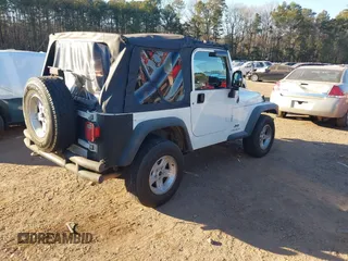 2004 Jeep Wrangler Sport Right Hand Drive with VIN 1J4F449S74P732854, listed as a IAAI auction lot 41408316 with 112,064 mi miles. Bid and sale history available at carsss.com. Image 4.