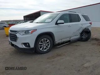 2018 Chevrolet Traverse LT Cloth z VIN 1GNEVGKW8JJ167095, wystawiony jako IAAI lot #41479356 z przebiegiem 98 615 mil mil oraz . Historia ofert i sprzedaży dostępna na DreamBid. Obrazek 19.