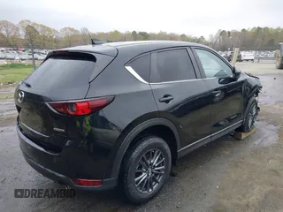 2020 Mazda CX-5 Touring with VIN JM3KFACM9L0770933, listed as a IAAI auction lot 41921464 with 75,997 mi miles. Bid and sale history available at carsss.com. Image 4.