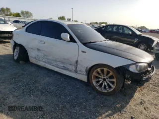 2010 BMW 1 Series 128i with VIN WBAUP9C54AVL89039, listed as a Copart auction lot 50907955 with 135,655 mi miles and Salvage Title. Bid and sale history available at DreamBid. Image 4.