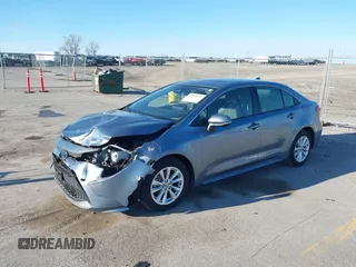 2023 Toyota Corolla Hybrid LE with VIN JTDBCMFEXPJ014034, listed as a IAAI auction lot 41865829 with 33,210 mi miles and . Bid and sale history available at carsss.com. Image 2.